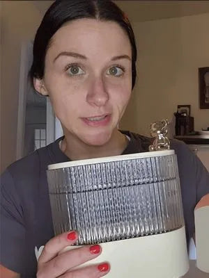 Person holding a make up organizer indoors