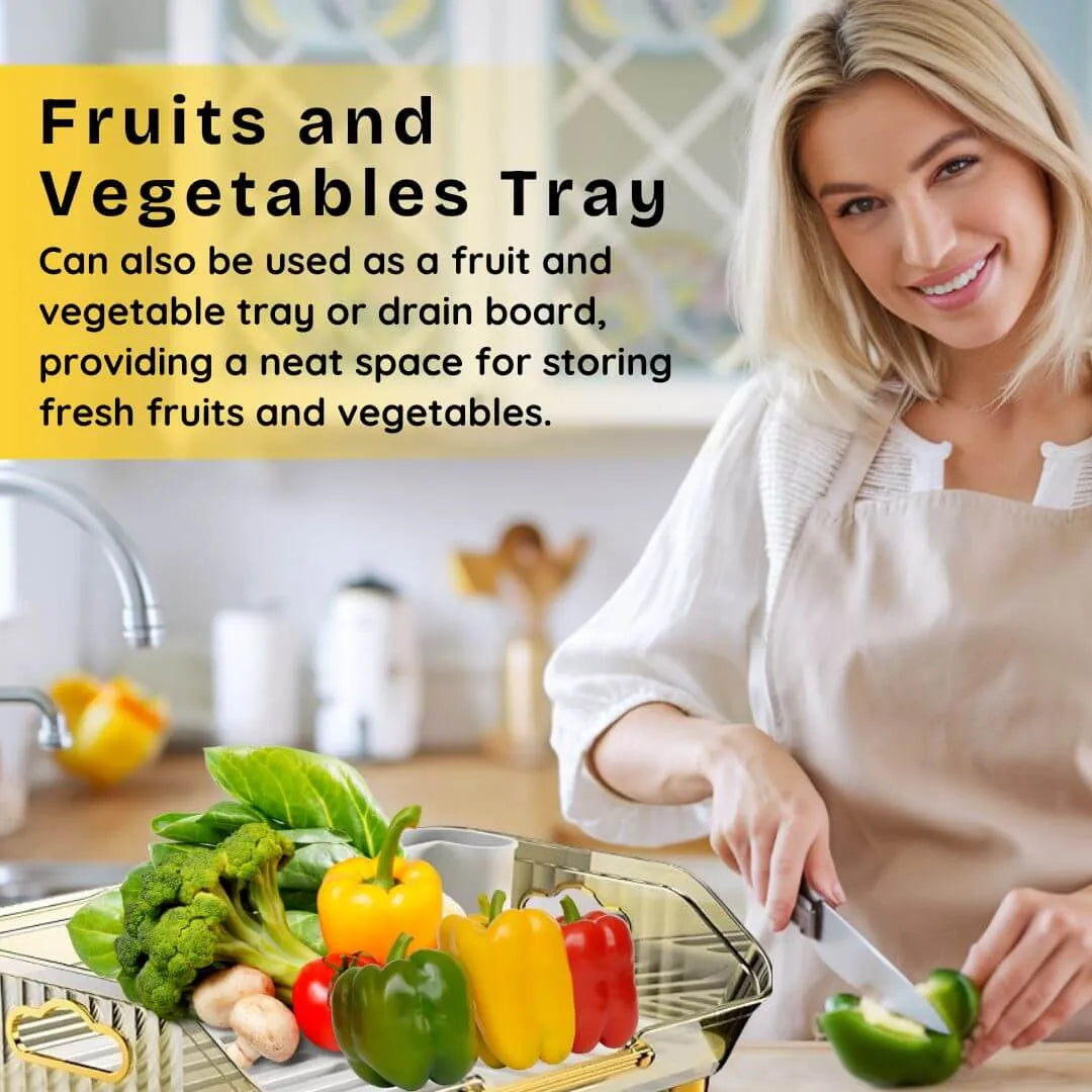 Woman in a kitchen with a fruits and vegetables tray, cutting vegetables.